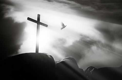 Cross silhouette against dramatic sky
